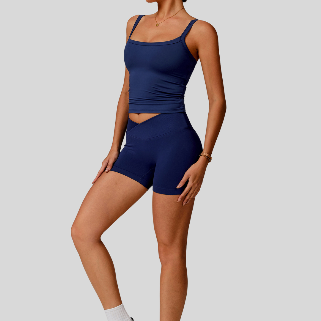 Side profile of model in Kaos The Label Zaya Set Navy, highlighting fit and design details