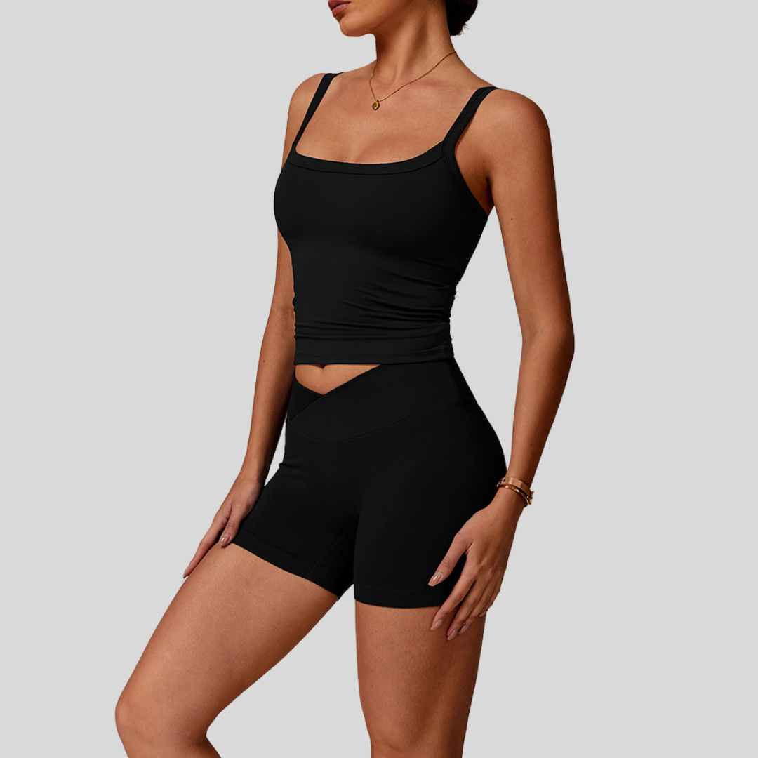 Side profile of model in Kaos The Label Zaya Set Black, highlighting fit and design details