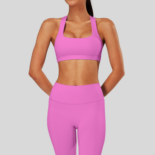 Front view of Kaos The Label Bloom Set in Pink, featuring high neck racer sports bra and high-waisted leggings
