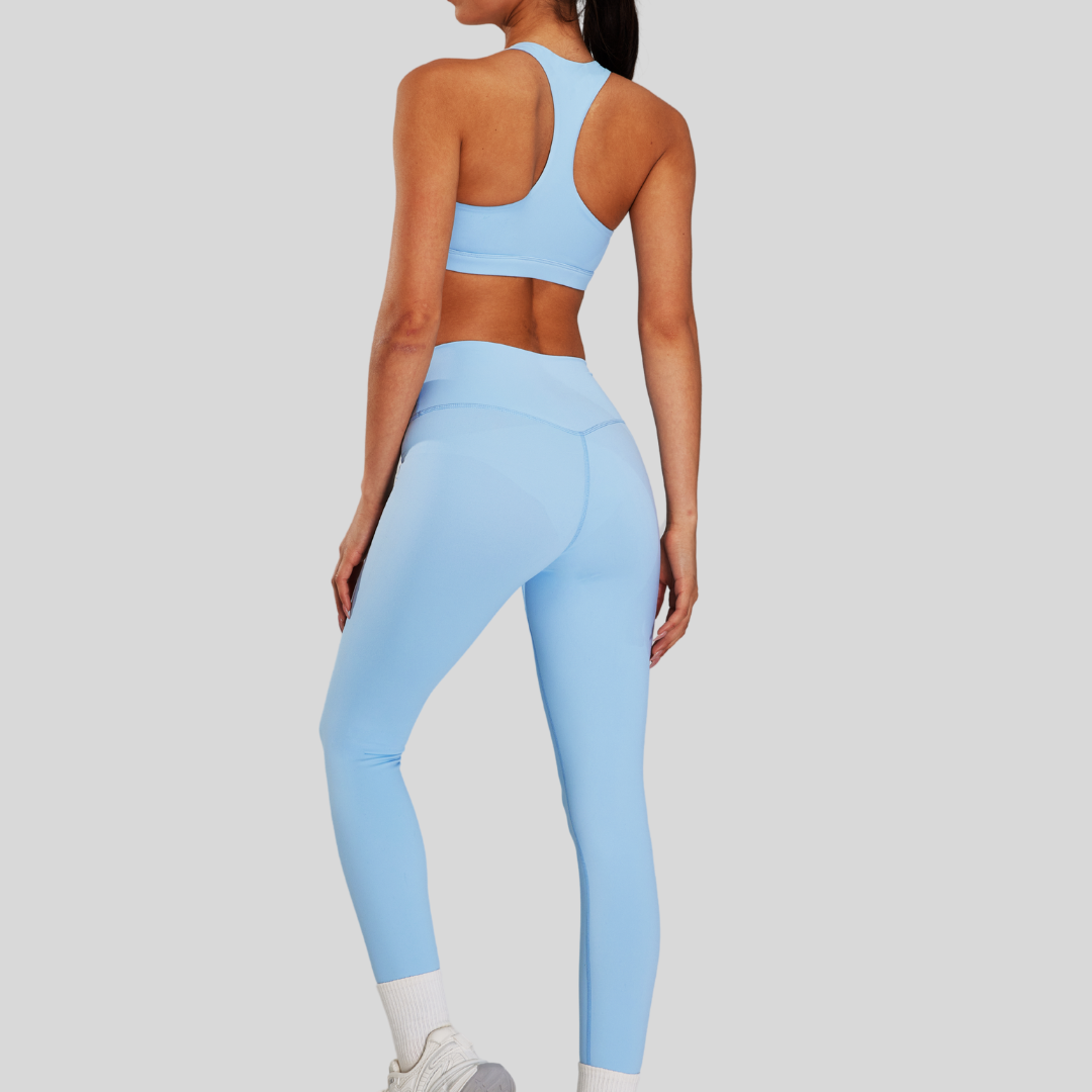 Back view of Kaos The Label Bloom Set in Blue, featuring high neck racer sports bra and high-waisted leggings