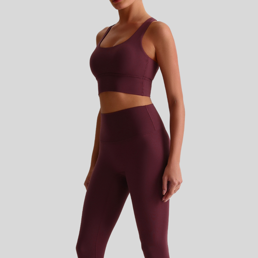 Close-up of KAOS The Label Isla Set red-brown fabric texture and stitching details.