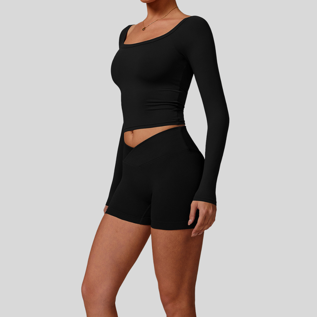 Side profile of model in Kaos The Label Cleo Set Black, highlighting fit and design details