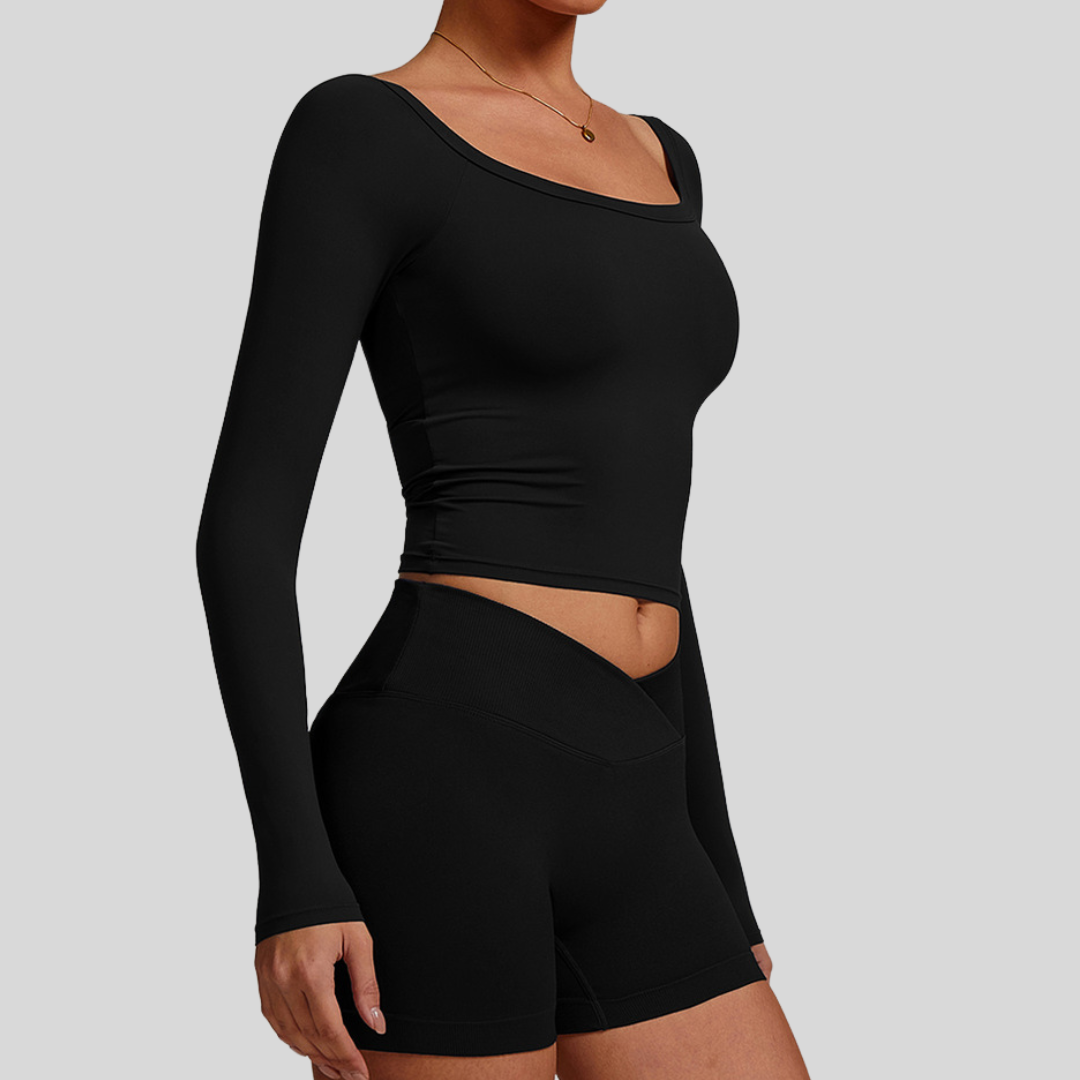 Side profile of model in Kaos The Label Cleo Set Black, highlighting fit and design details