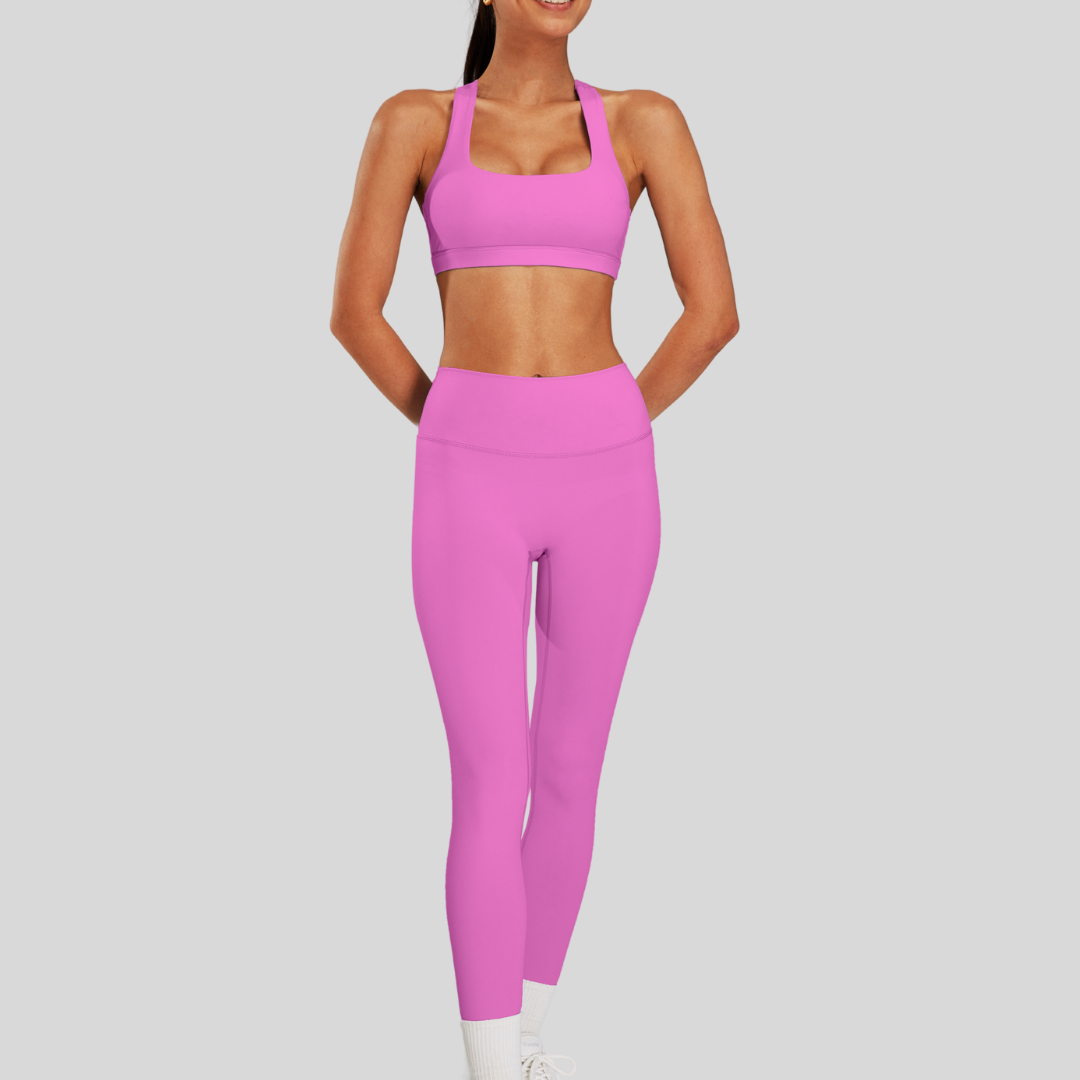 Model wearing Kaos The Label Bloom Set in Pink, showcasing front view of seamless activewear set