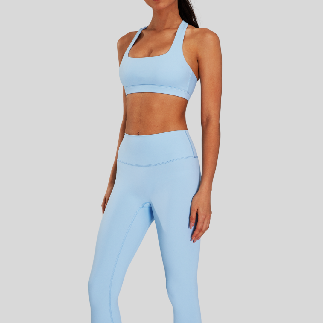 Front view of Kaos The Label Bloom Set in Blue, featuring high neck racer sports bra and high-waisted leggings