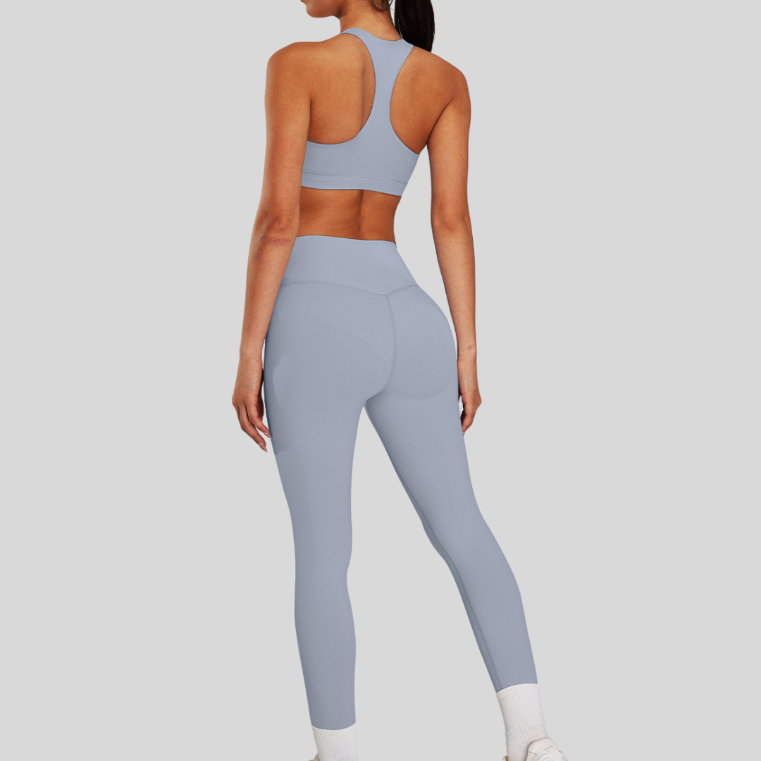 Back view of Kaos The Label Bloom Set in Gray, featuring high neck racer sports bra and high-waisted leggings