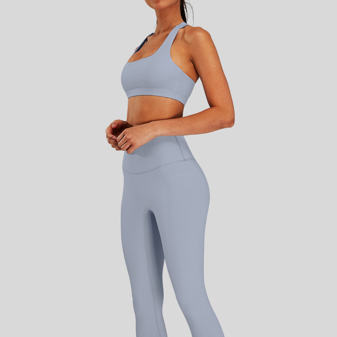 Side view of Kaos The Label Bloom Set in Gray, featuring high neck racer sports bra and high-waisted leggings