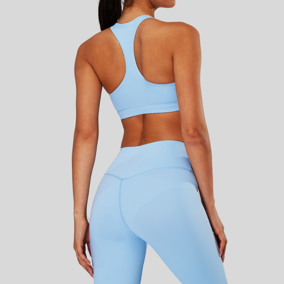 Back view of Kaos The Label Bloom Set in Blue, featuring high neck racer sports bra and high-waisted leggings