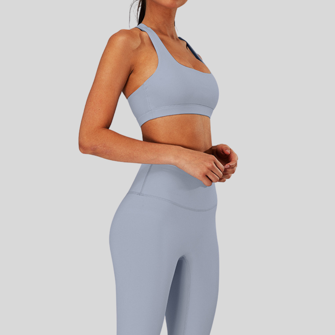Side view of Kaos The Label Bloom Set in Gray, featuring high neck racer sports bra and high-waisted leggings
